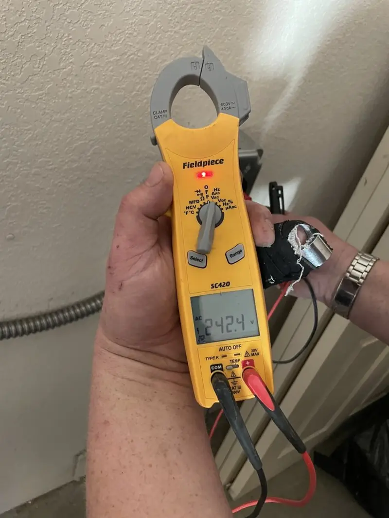 Voltage testing with clamp meter during Circuit Breaker Repair in Hampstead